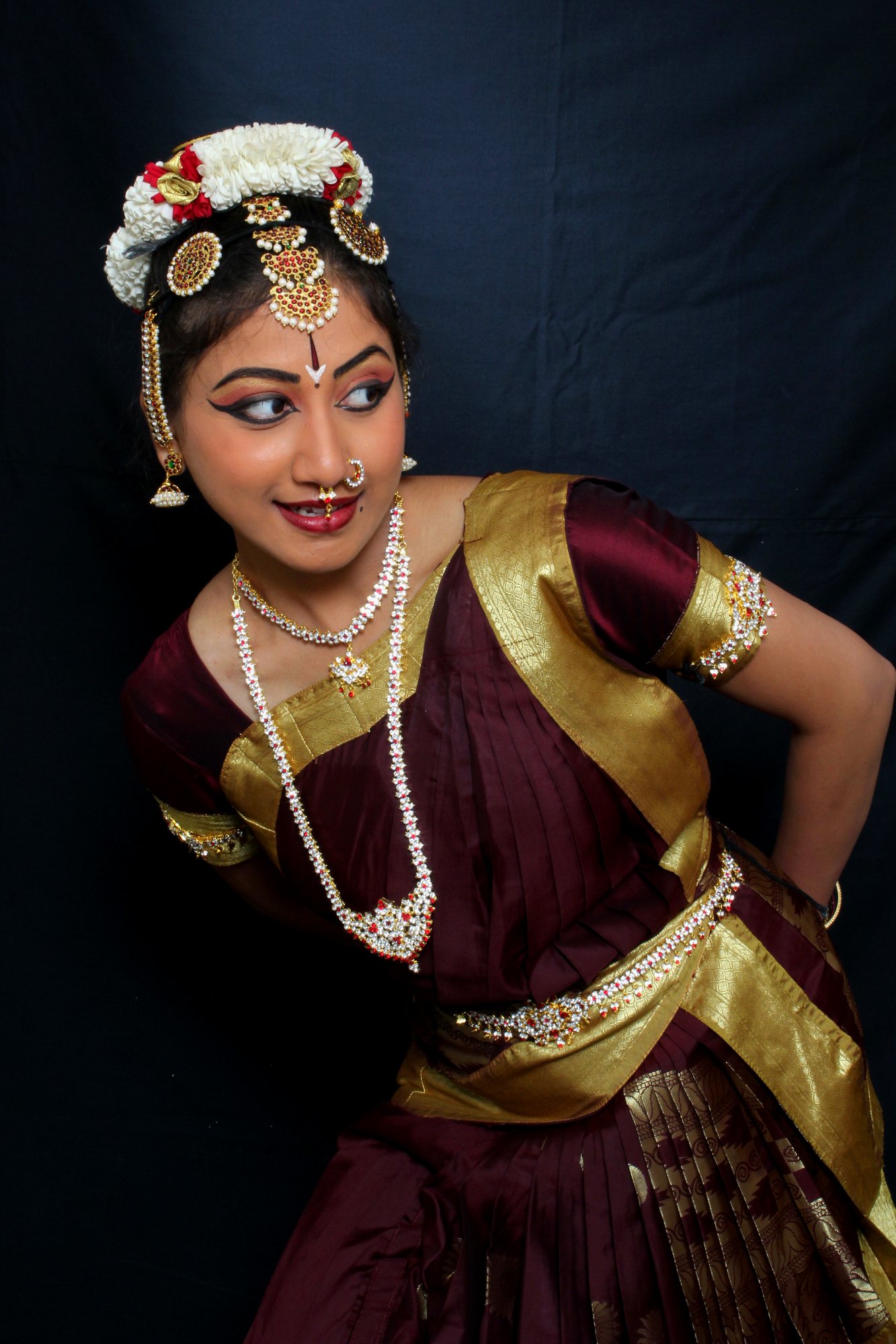 Playful Bharatanatyam pose, hand on hip