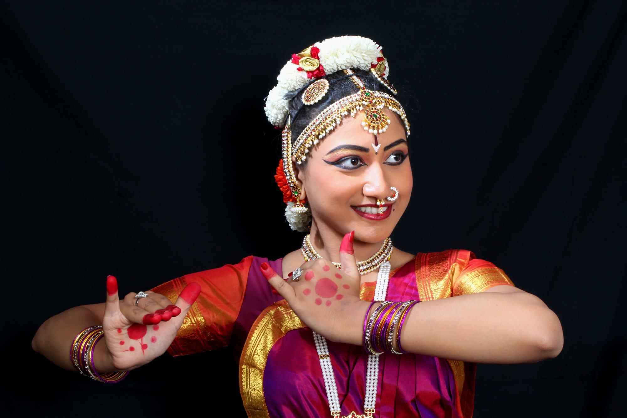 Smiling wide Bharatanatyam dance pose