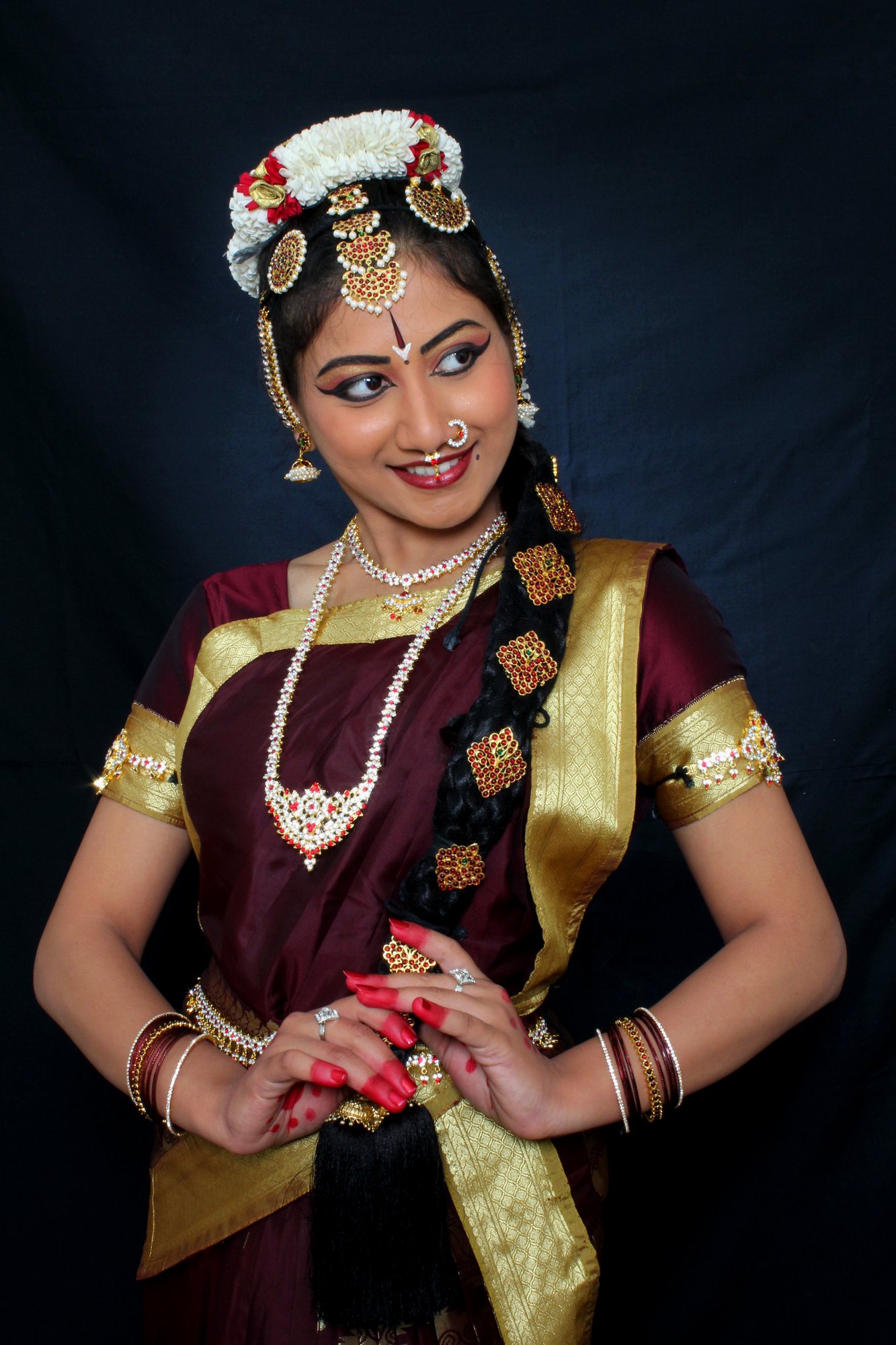 Poised Bharatanatyam stance with clasped hands