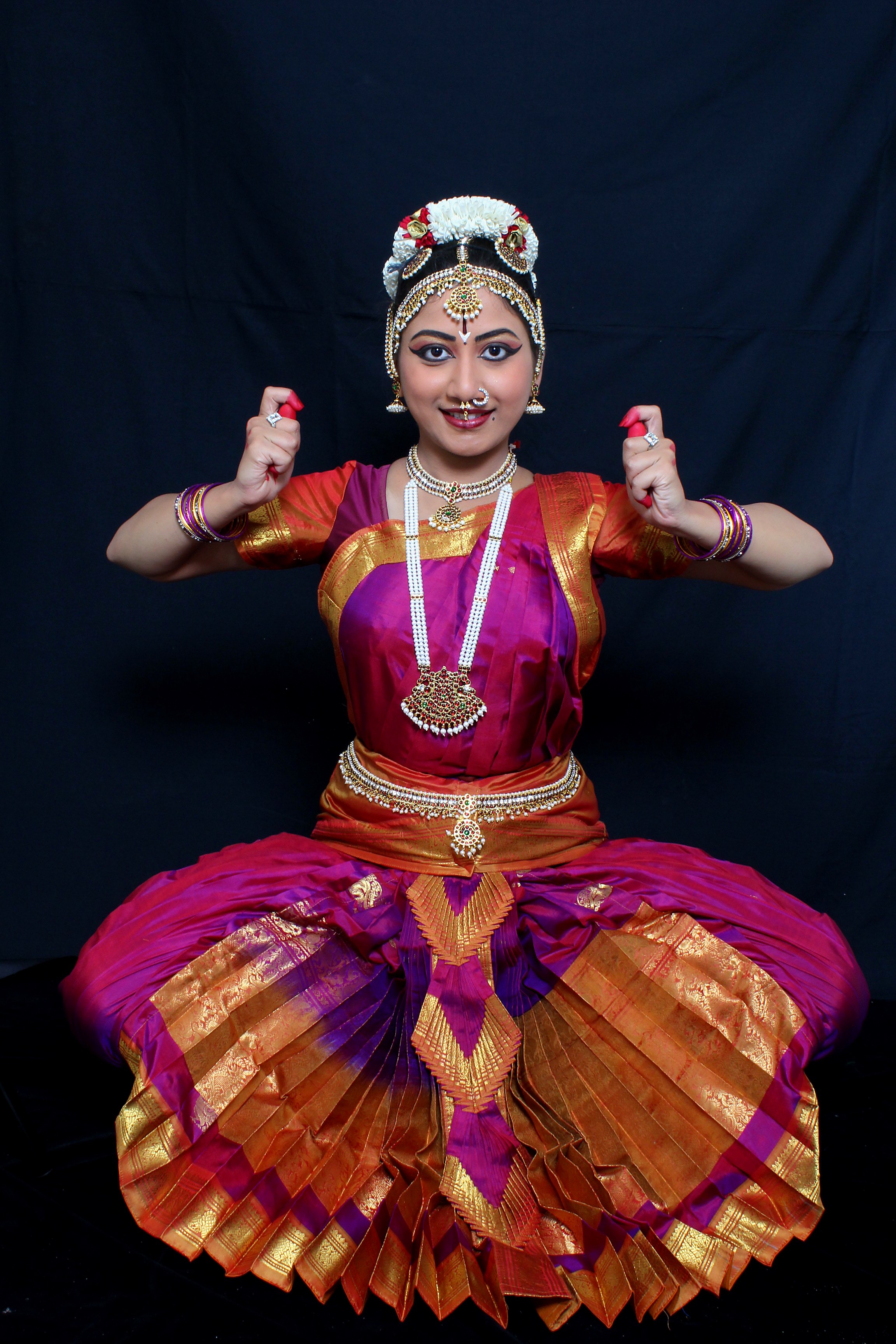 Full seated Bharatanatyam pose with pleats fanned wide